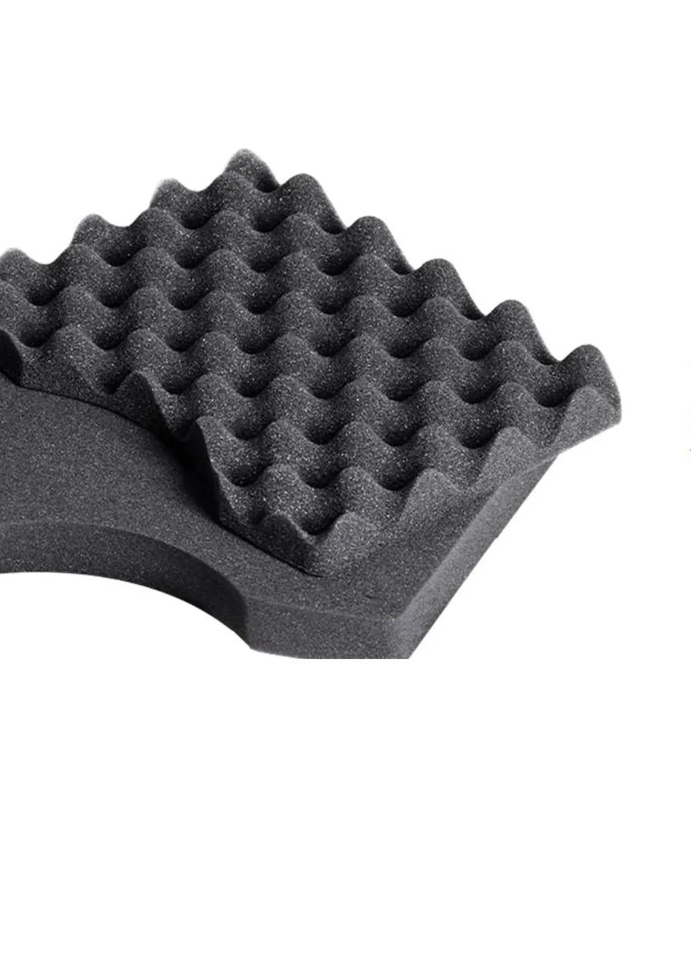 A close-up of a black Handexer grip strength hand dynamometer component with a textured, wavy surface, suitable for grip strength measurement and isometric handgrip exercises.