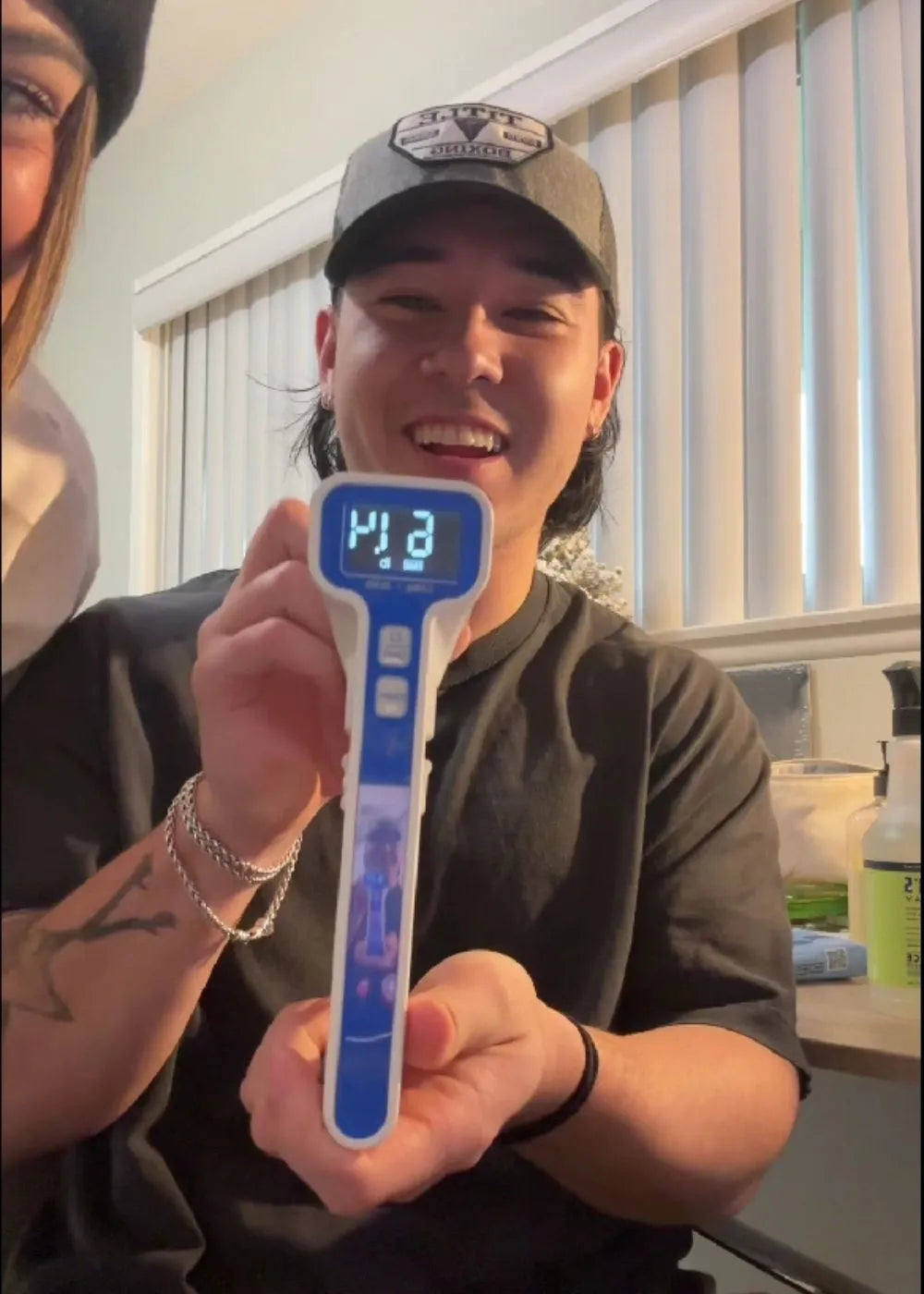 A promotional image for Handexer's Grip Strength Hand Dynamometer during a Christmas Sale. The image features the Handexer dynamometer in the foreground with Christmas decorations like metallic trees and ornaments in the background. Text highlights "Christmas Sale," "UP TO 28% OFF," and product features: "FDA REGISTERED," "HIGH ACCURACY," "EASY-READING LCD." A tagline suggests using it as a Christmas gift for family grip strength challenges. Keywords: Handexer, Grip Strength Hand Dynamometer, Christmas Sale