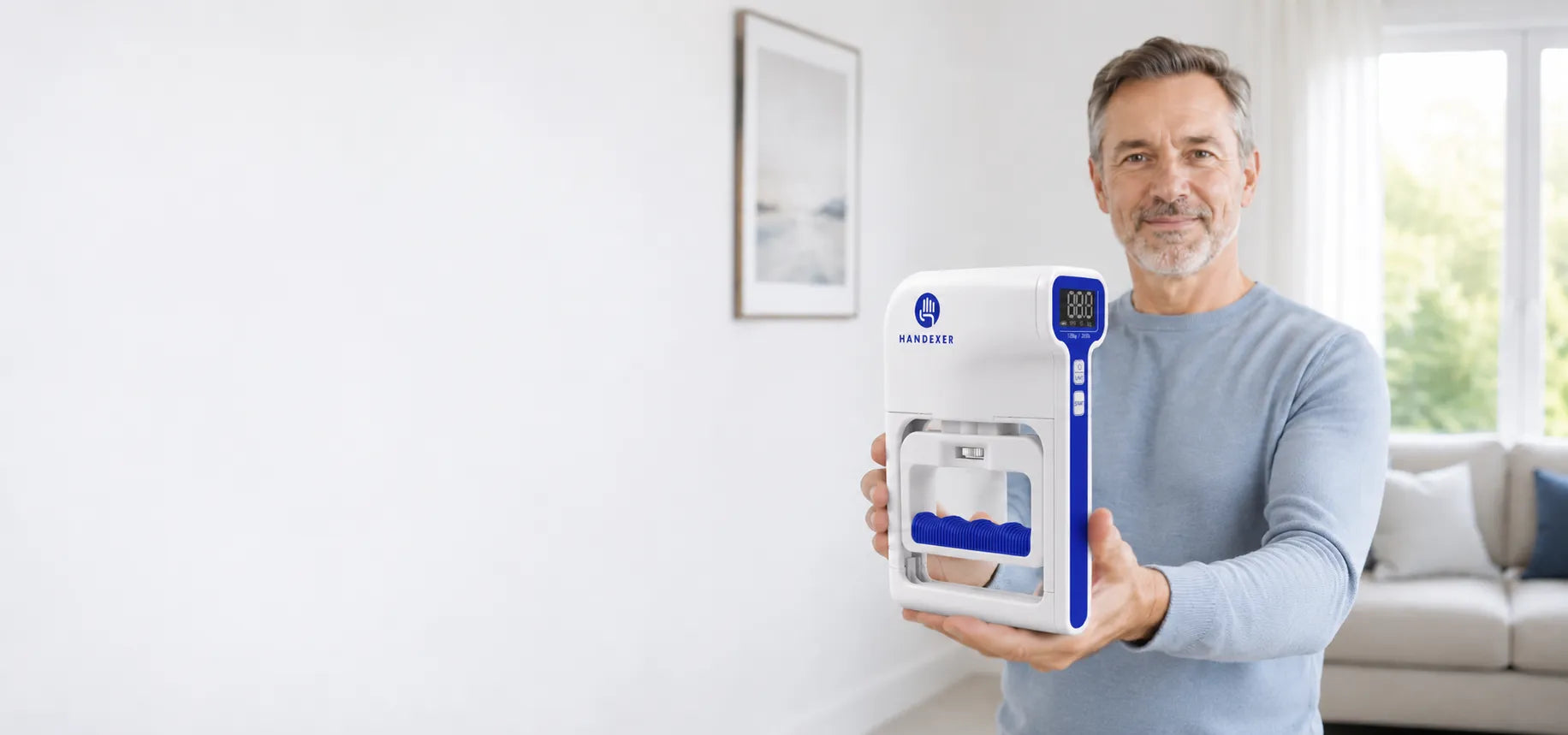 Handexer digital hand dynamometer shown by a man in a bright living room with wide banner space