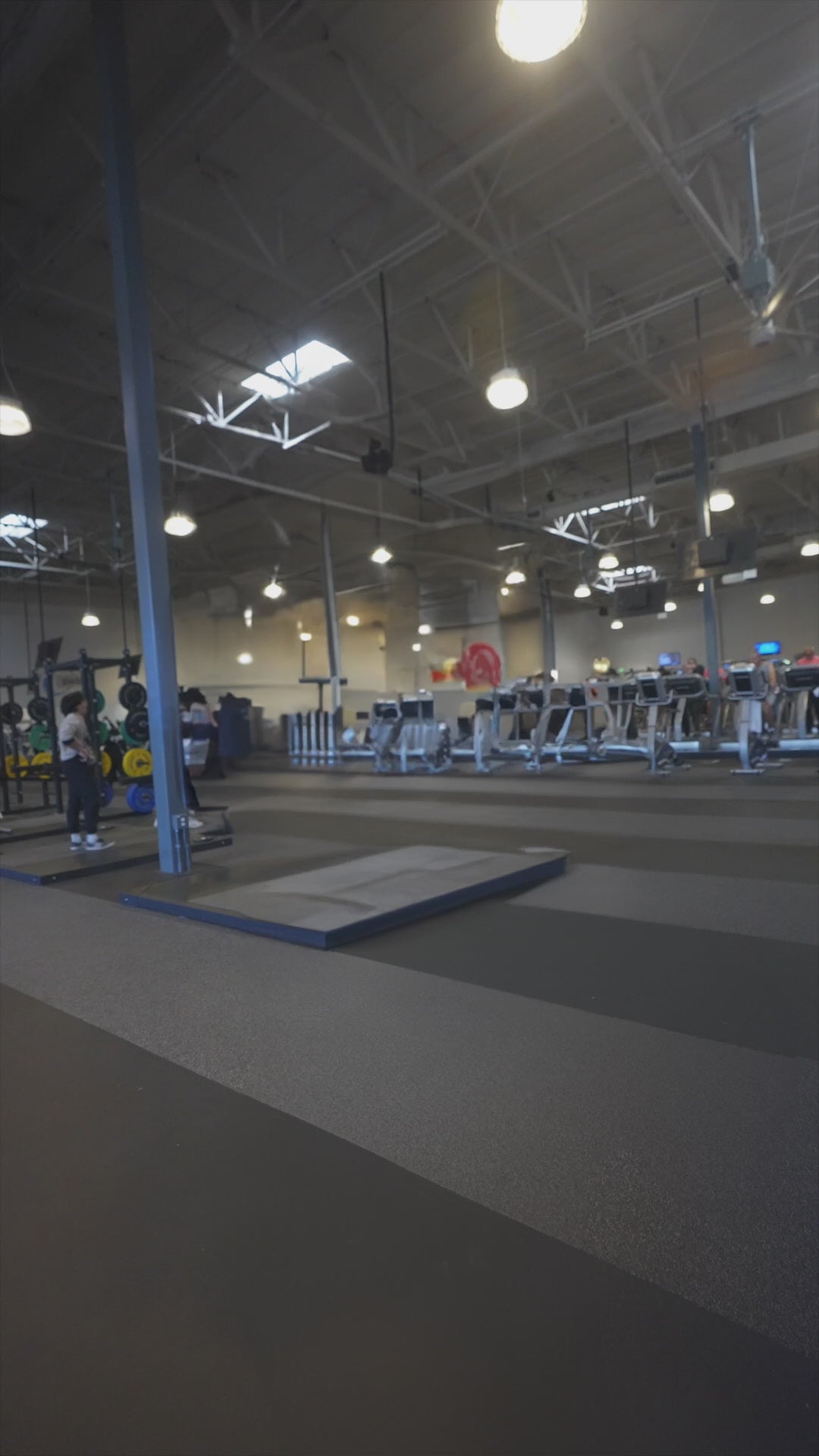 Load video: Man holding a Handexer digital hand dynamometer in a gym, showing grip strength testing during a fitness training session